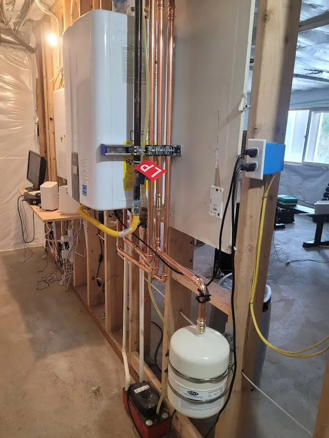 Licensed plumber repairing a kitchen sink in Pipestone